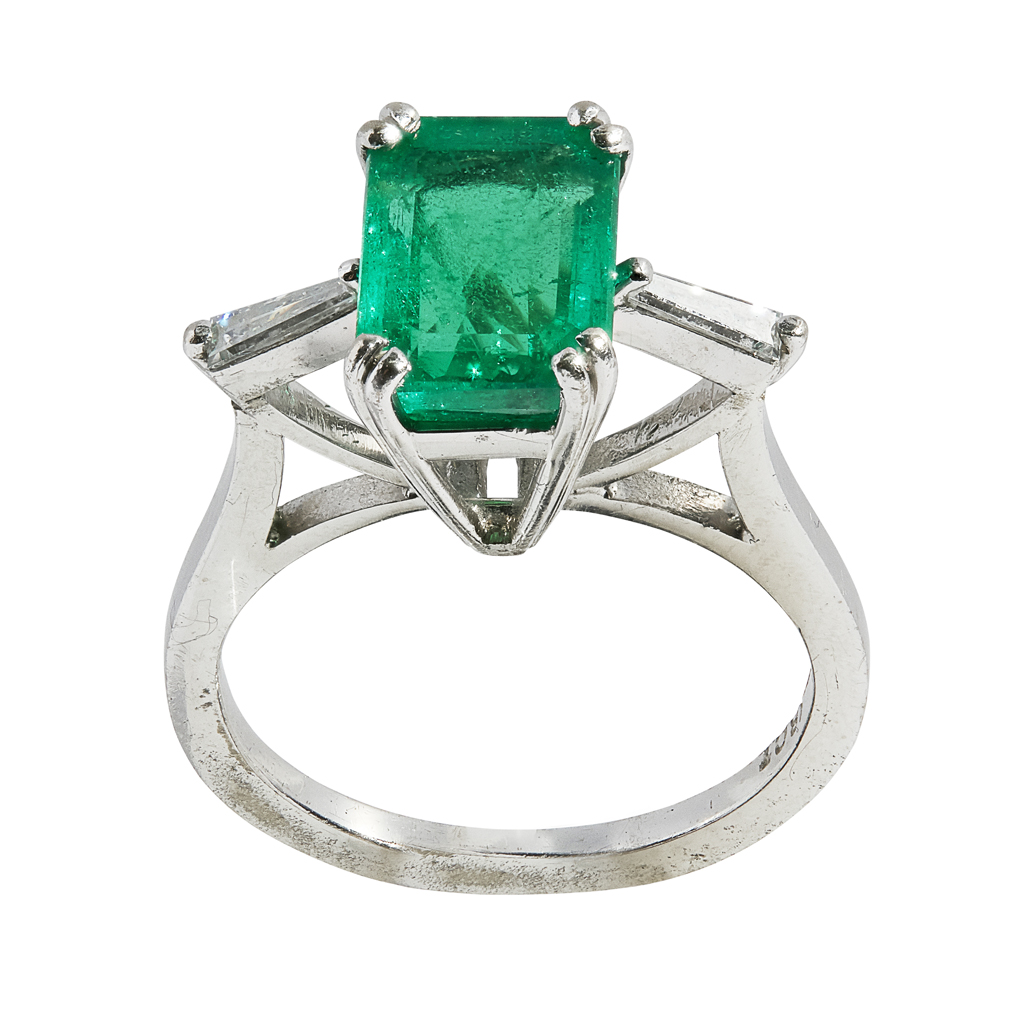 An emerald and diamond set ring