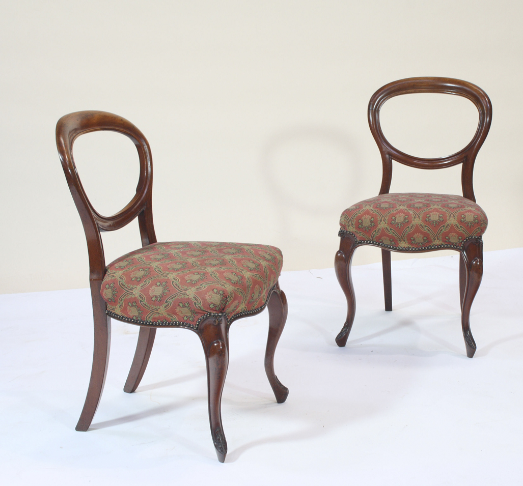 A set of six Victorian mahogany balloon back chairs