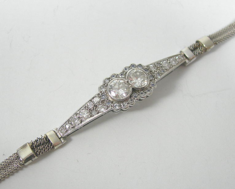 An early 20th century 9ct white gold mounted diamond bracelet,