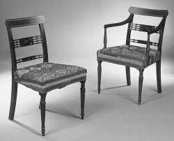 A set of eight Edwardian mahogany Sheraton style dining chairs