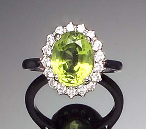 A peridot and diamond cluster ring,