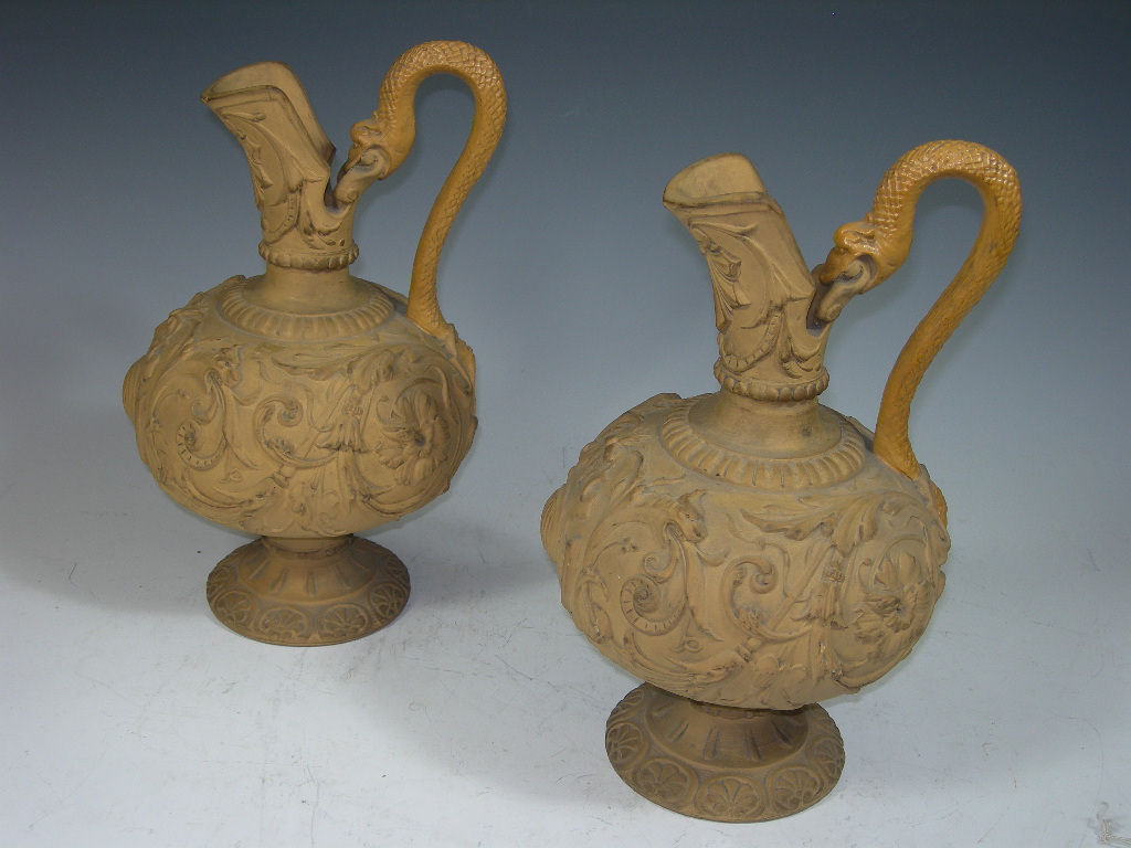 A pair of continental ceramic ewers