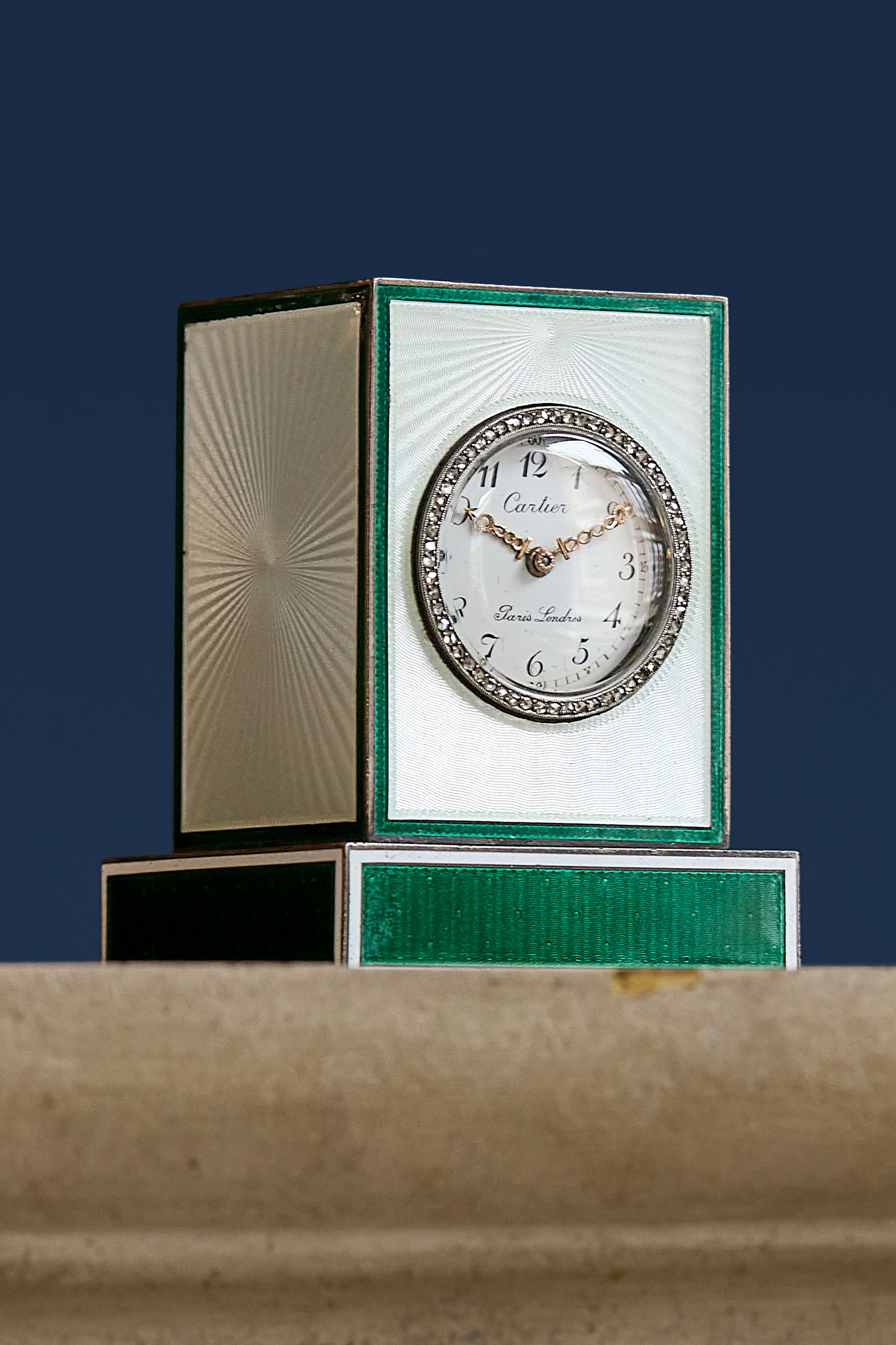 Cartier, Paris-London. An exceptional silver, diamond, white and green guilloche enamel eight day clock with ivory baseplate