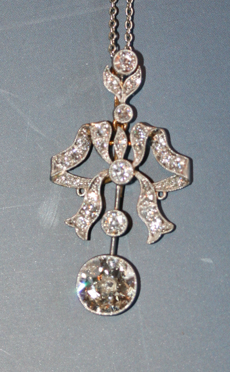 An Edwardian diamond set pendant with chain