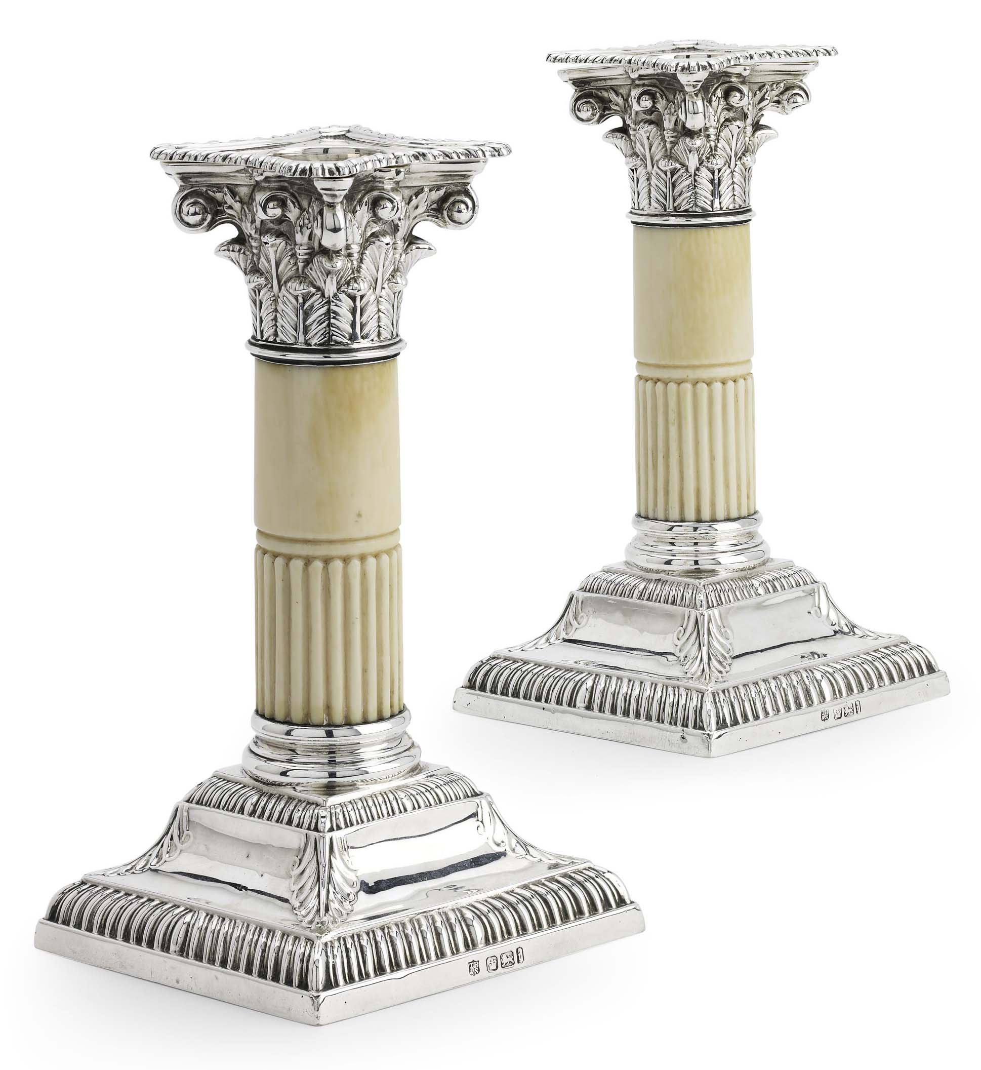 A pair of Edwardian silver and ivory dwarf table candlesticks