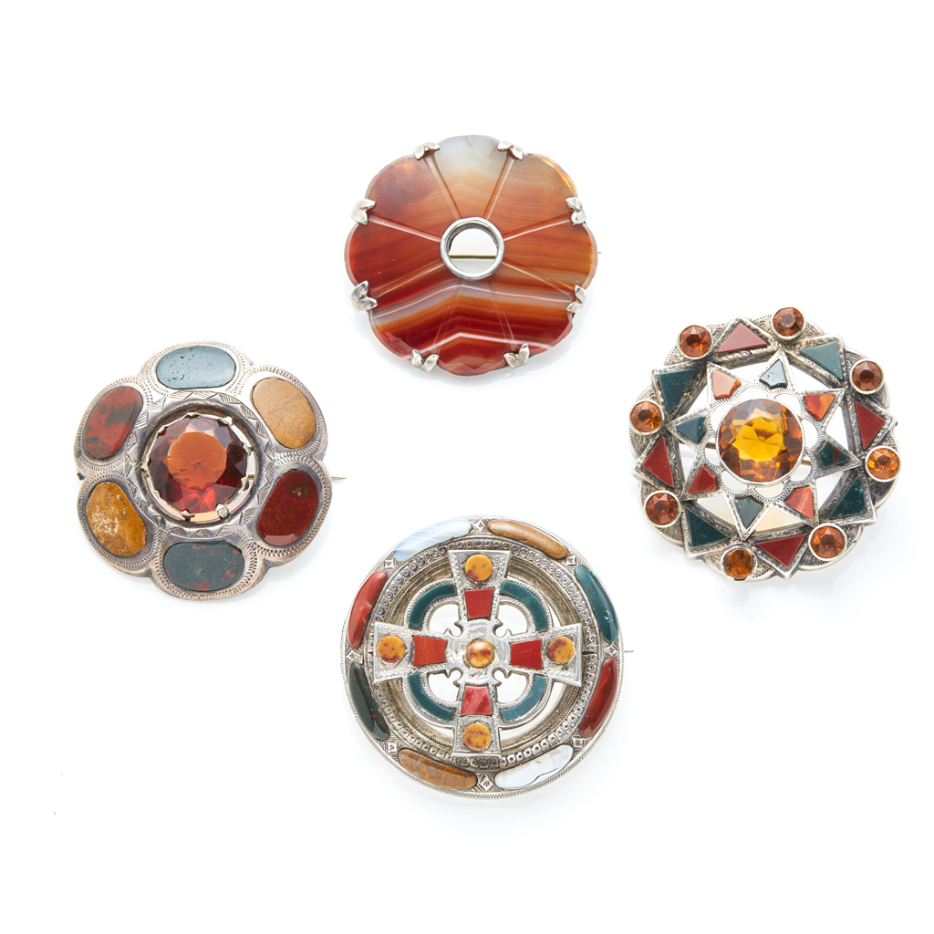 A collection of agate set brooches