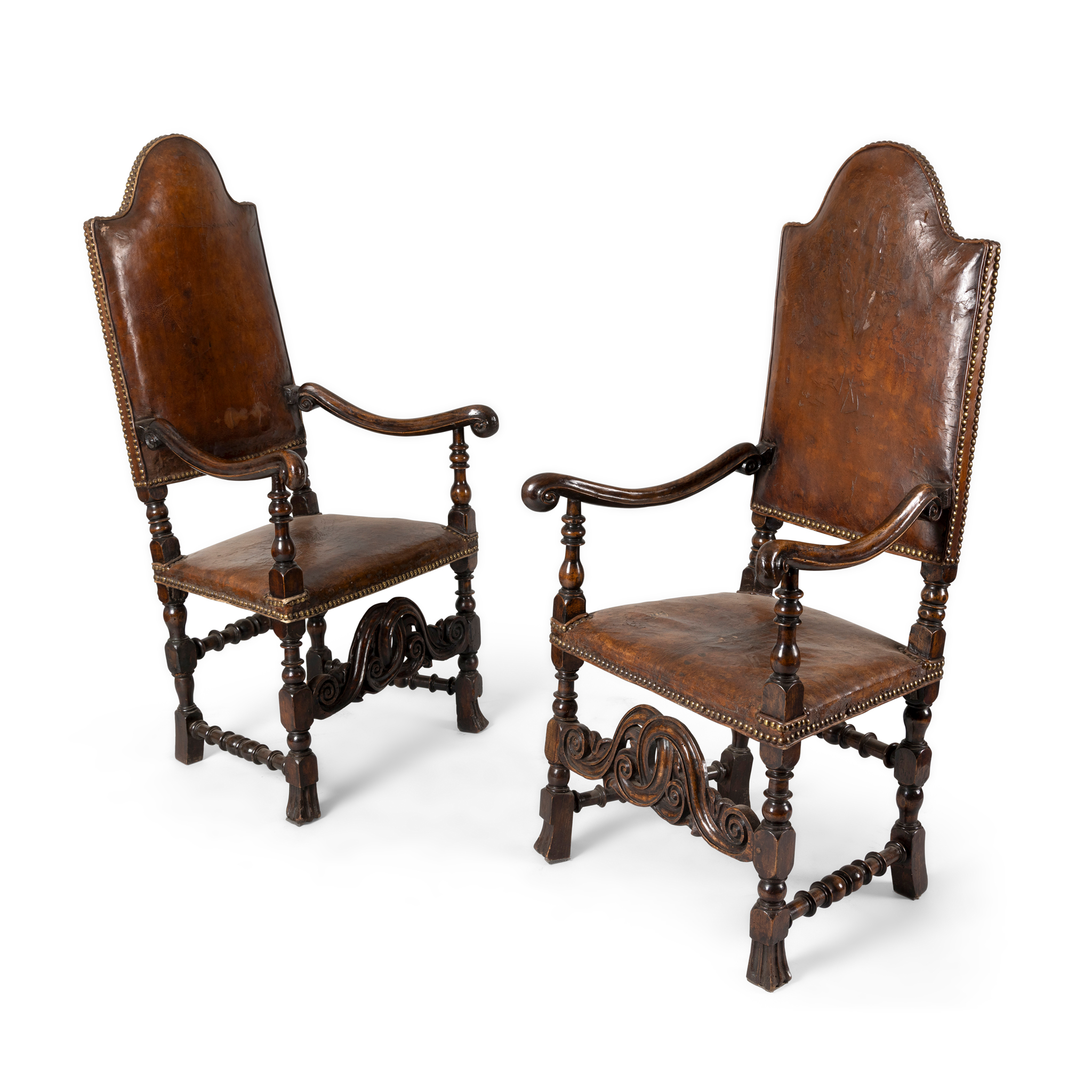 A PAIR OF CONTINENTAL WALNUT, OAK AND LEATHER UPHOLSTERED HIGH BACK ARMCHAIRS
