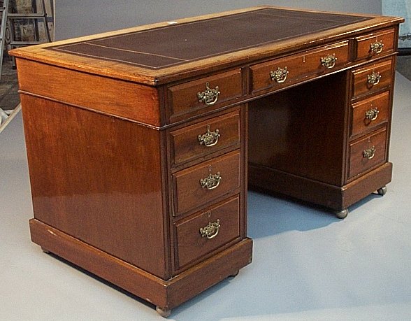 A mahogany kneehole desk