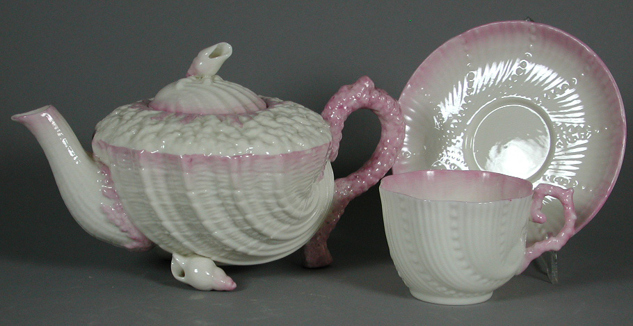 A Belleek ivory and pink shell shaped teapot and cover