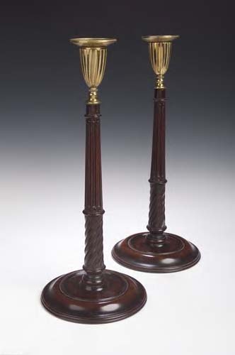 A pair of George III mahogany candlesticks,
