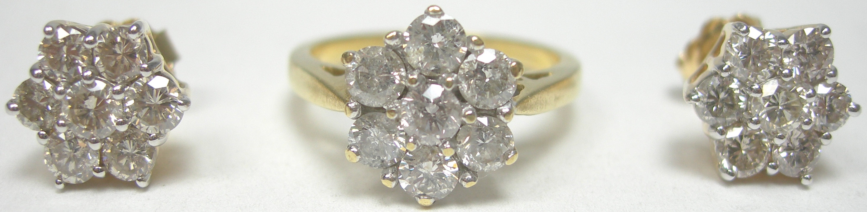 An 18ct gold mounted diamond set suite,