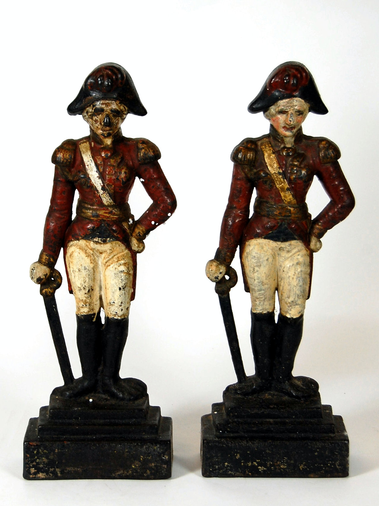 Two painted cast iron door stops of 19th century army officers