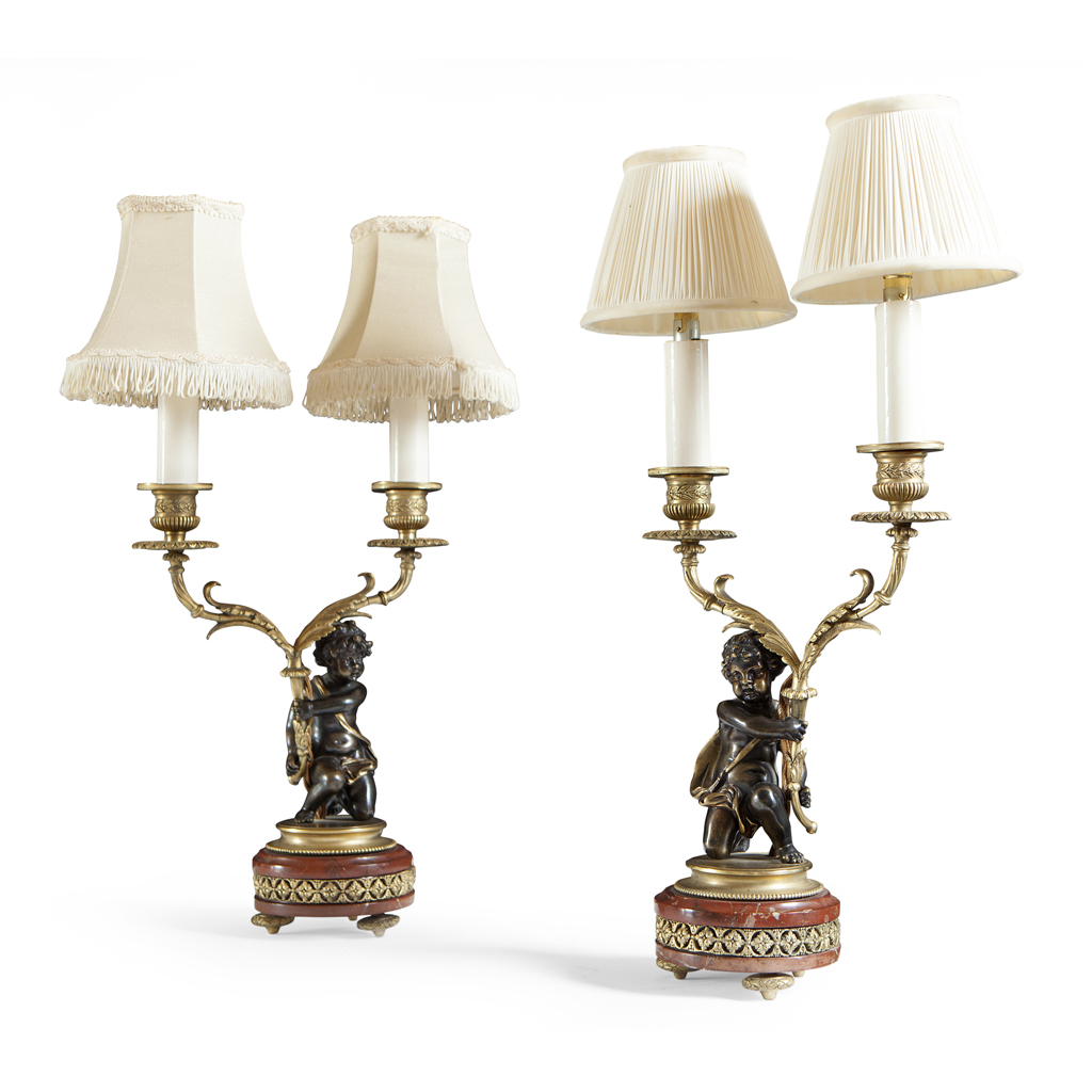A PAIR OF BRONZE AND GILT METAL MOUNTED TWIN-BRANCH CANDELABRA