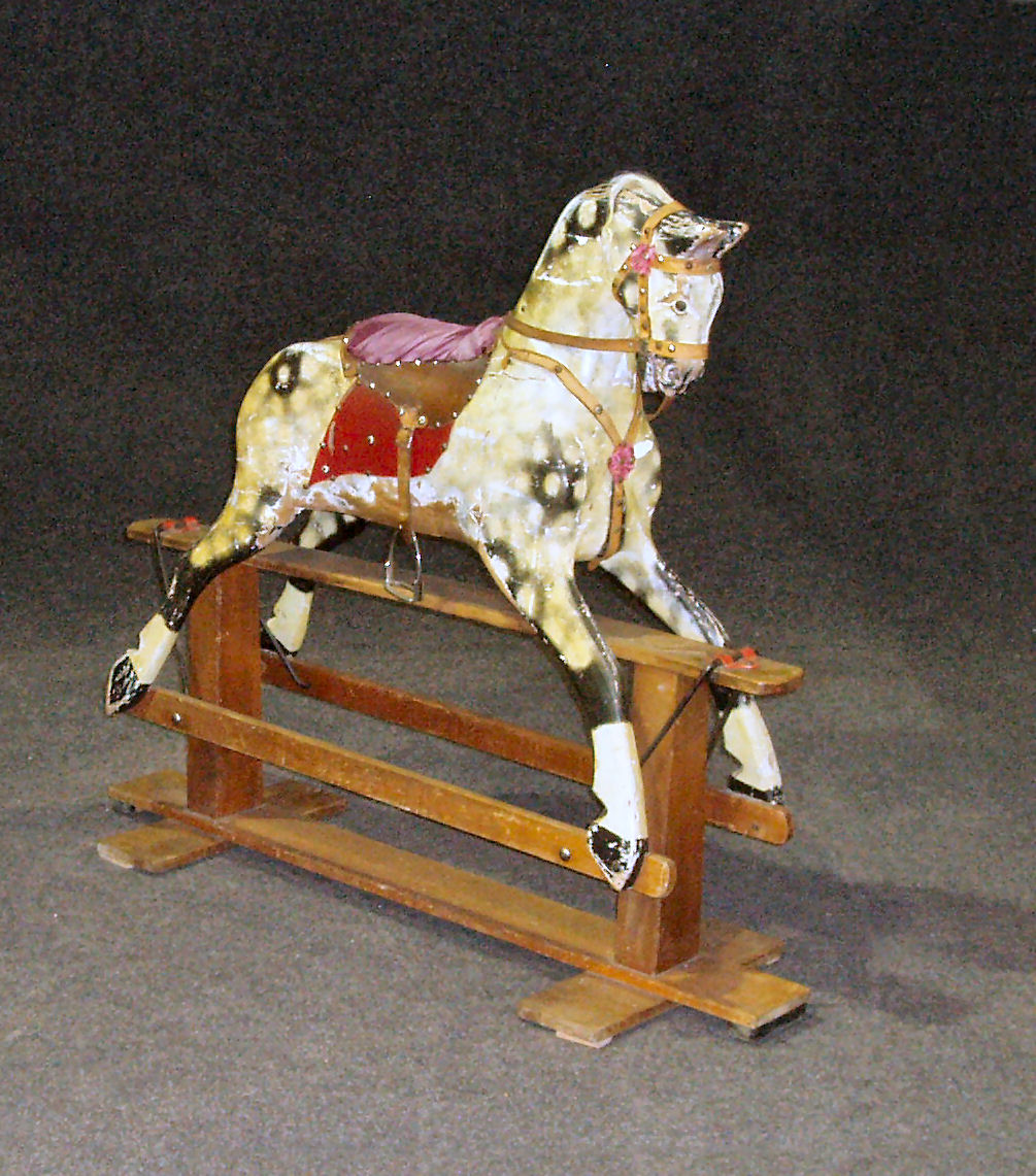 An early 20th century painted wooden rocking horse