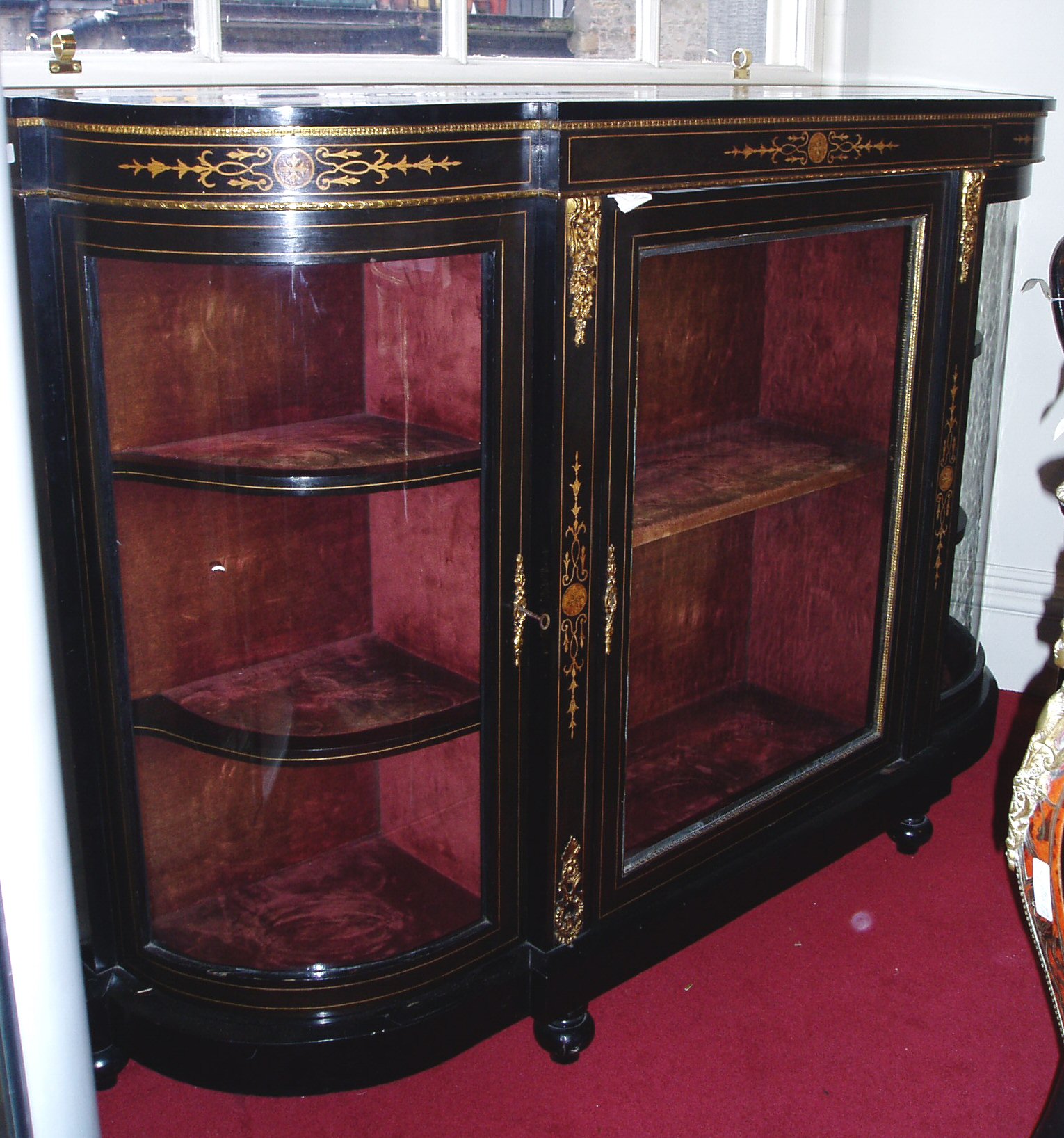 A Victorian ebonised credenza,