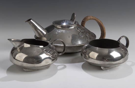 A Tudric pewter three-piece tea service