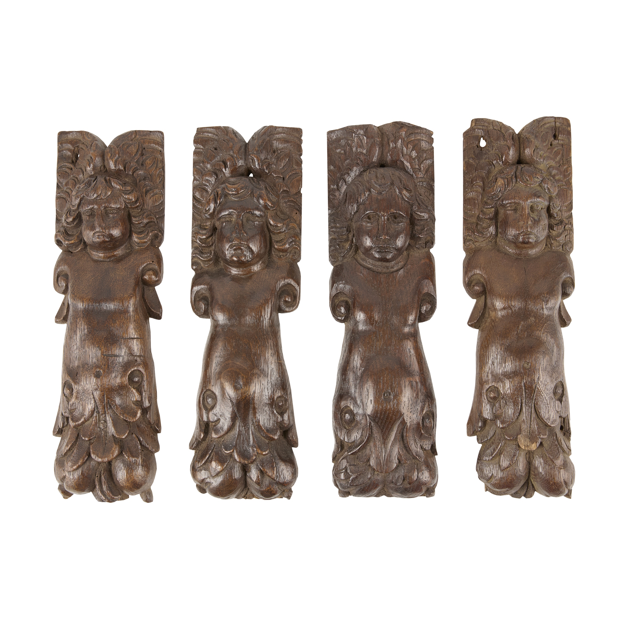 SET OF FOUR CARVED OAK FIGURAL APPLIQUES