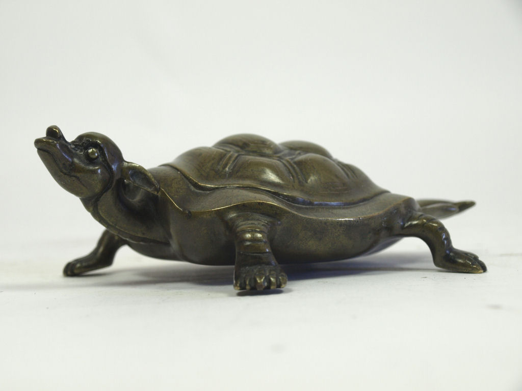 An 18th/19th century Chinese bronze inlaid mythical tortoise