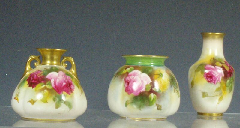 A group of Royal Worcester rose painted vases