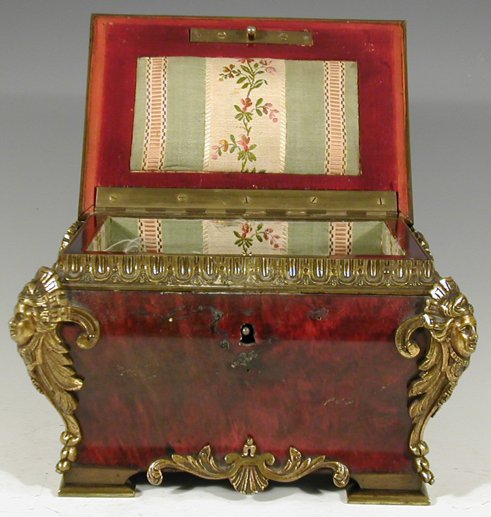 A Victorian tortoiseshell and gilt brass mounted bombe workbox,