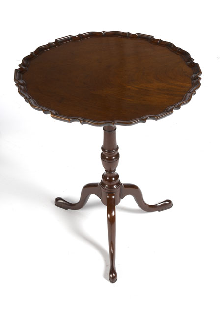 A George III mahogany 'pie crust' occasional table In the Chippendale manner