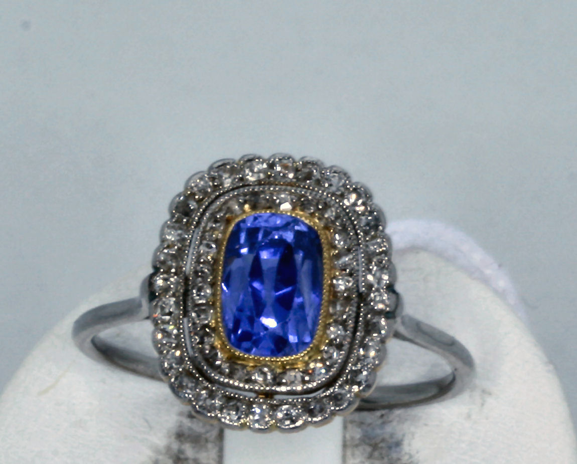 An early 20th century sapphire and diamond cluster ring