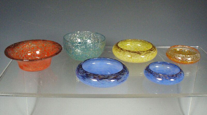 A collection of Monart glass
