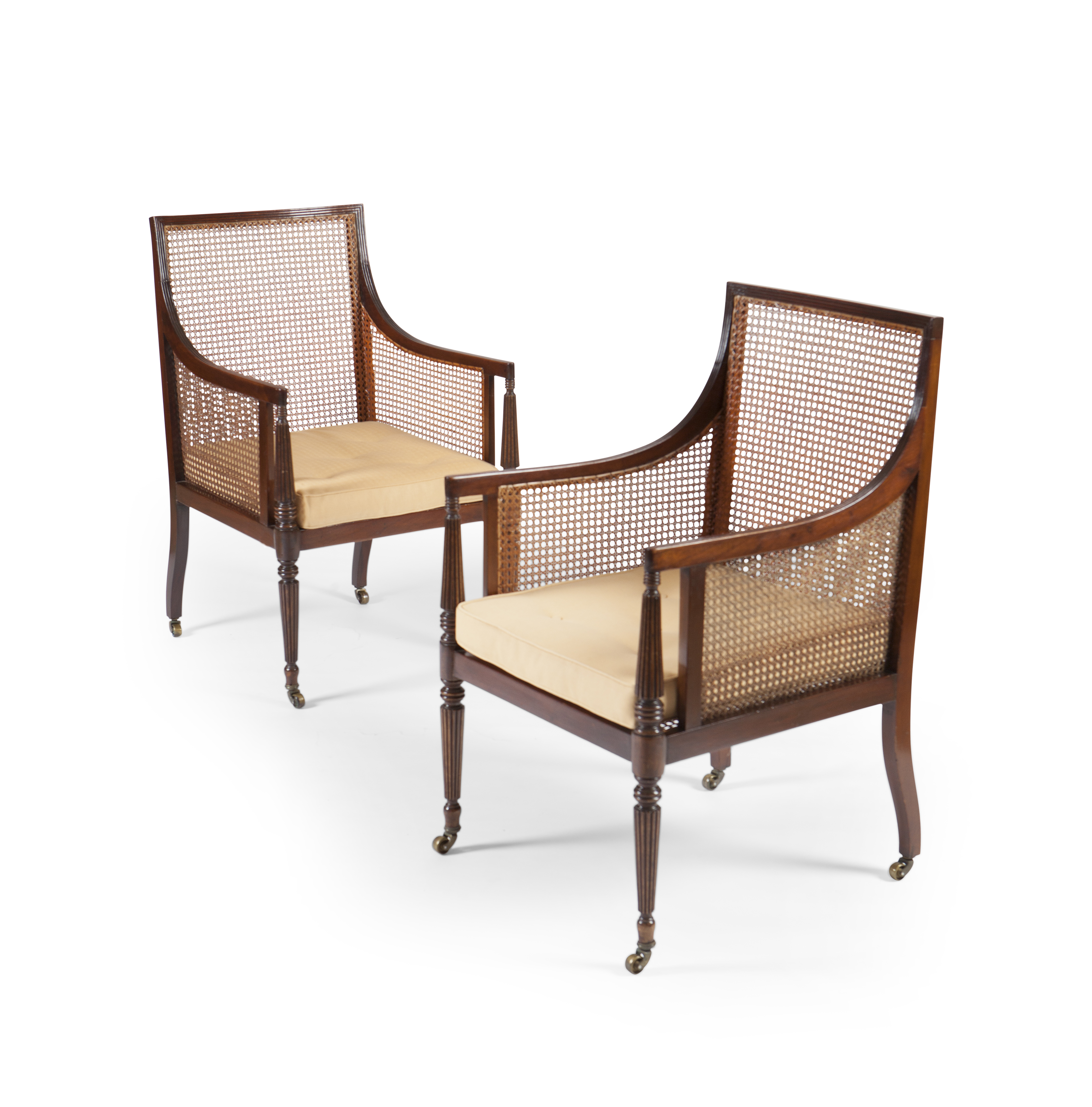 PAIR OF REGENCY STYLE MAHOGANY LIBRARY ARMCHAIRS