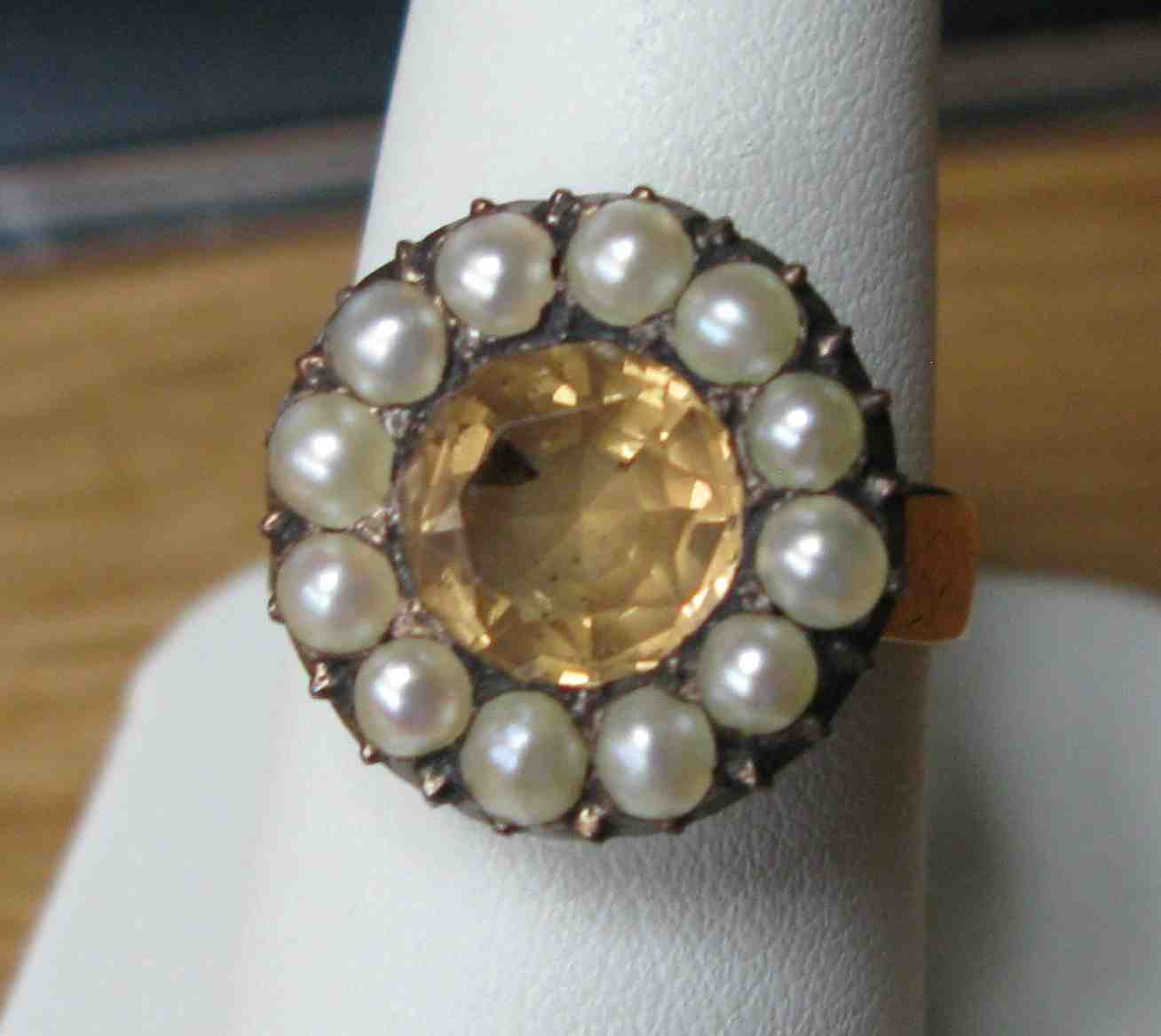 A group of three gem set rings to include