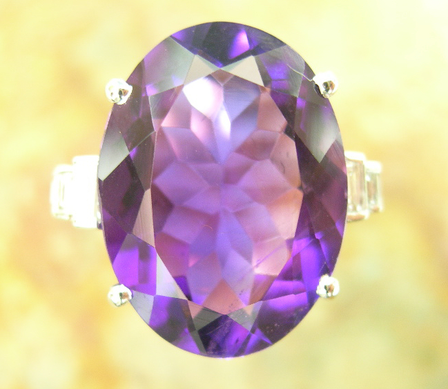 An 18ct white gold mounted amethyst and diamond set cocktail ring,