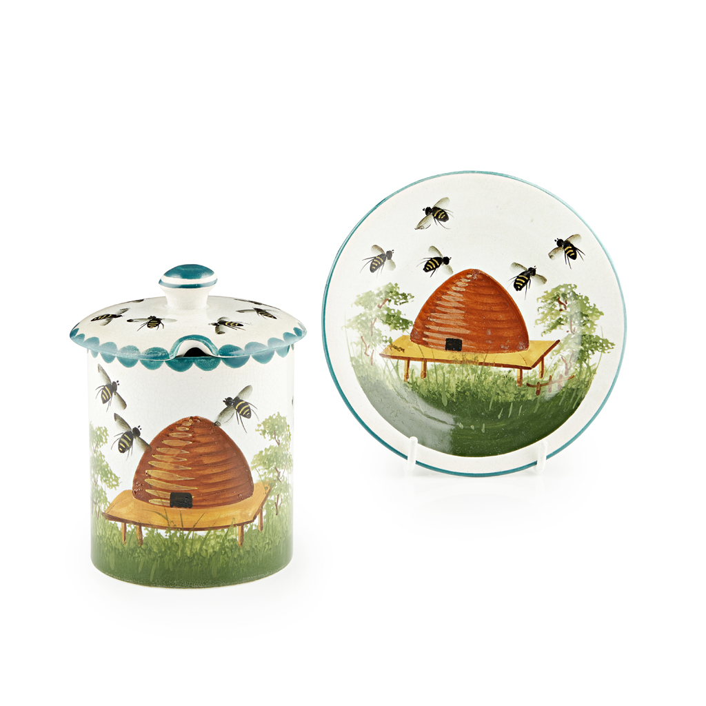 A WEYMSS WARE PRESERVE JAR AND COVER AND A SAUCER