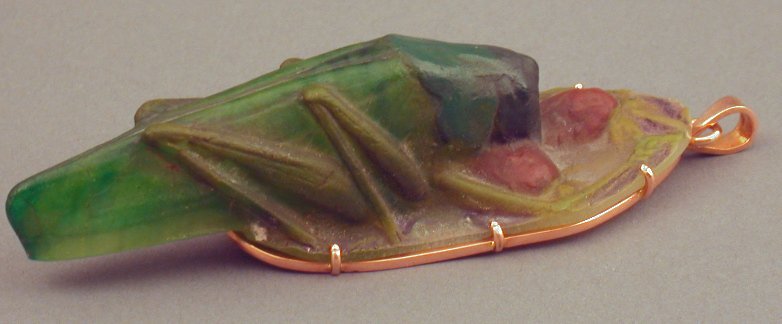 An Argy-Rousseau pate de verre and gold mounted pendant