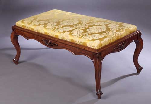 A Victorian walnut long stool