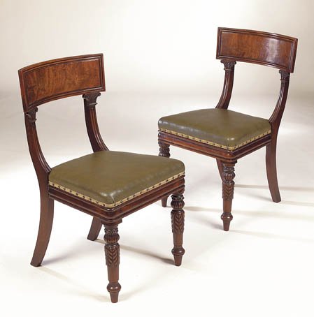 A set of twelve Regency mahogany dining chairs,