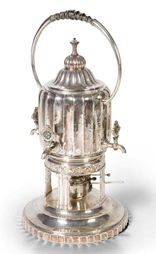 An early 20th century German tea kettle on stand with burner