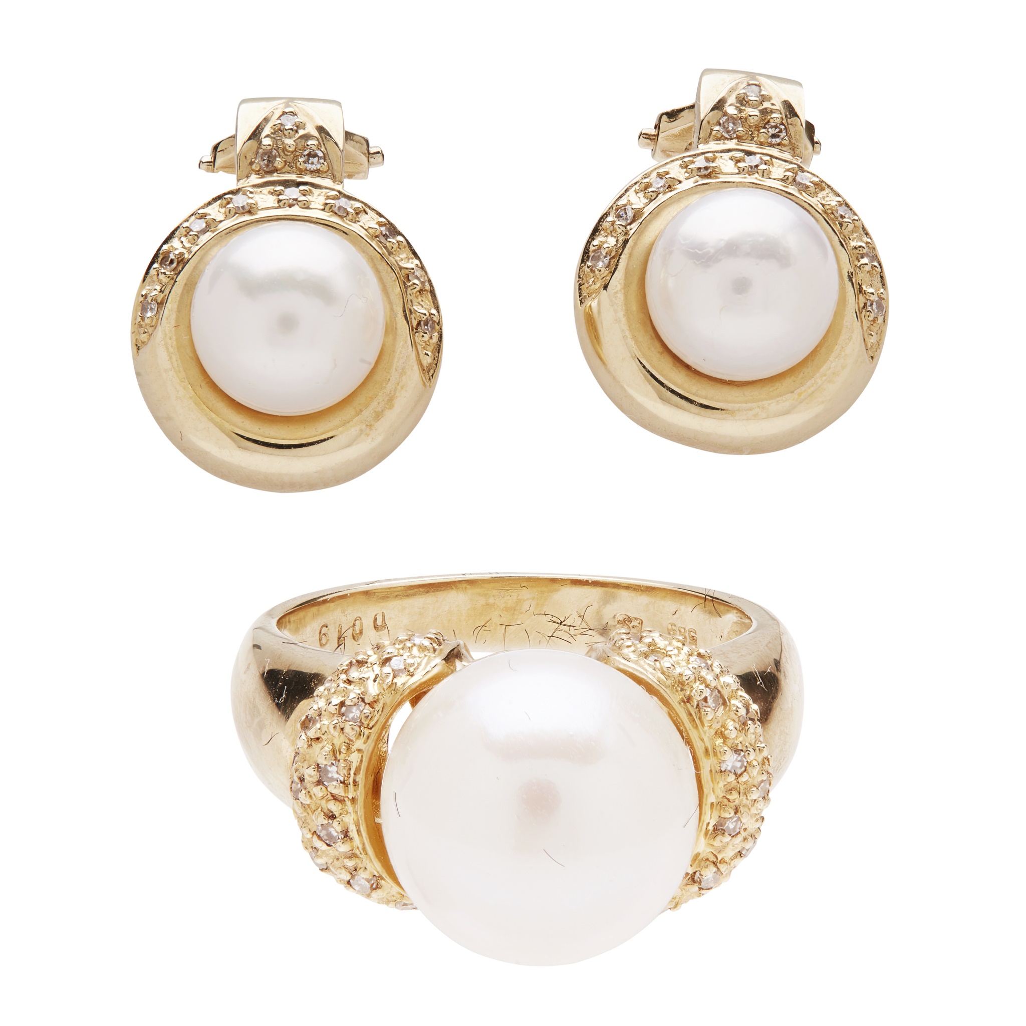 A pearl and diamond set ring and earrings