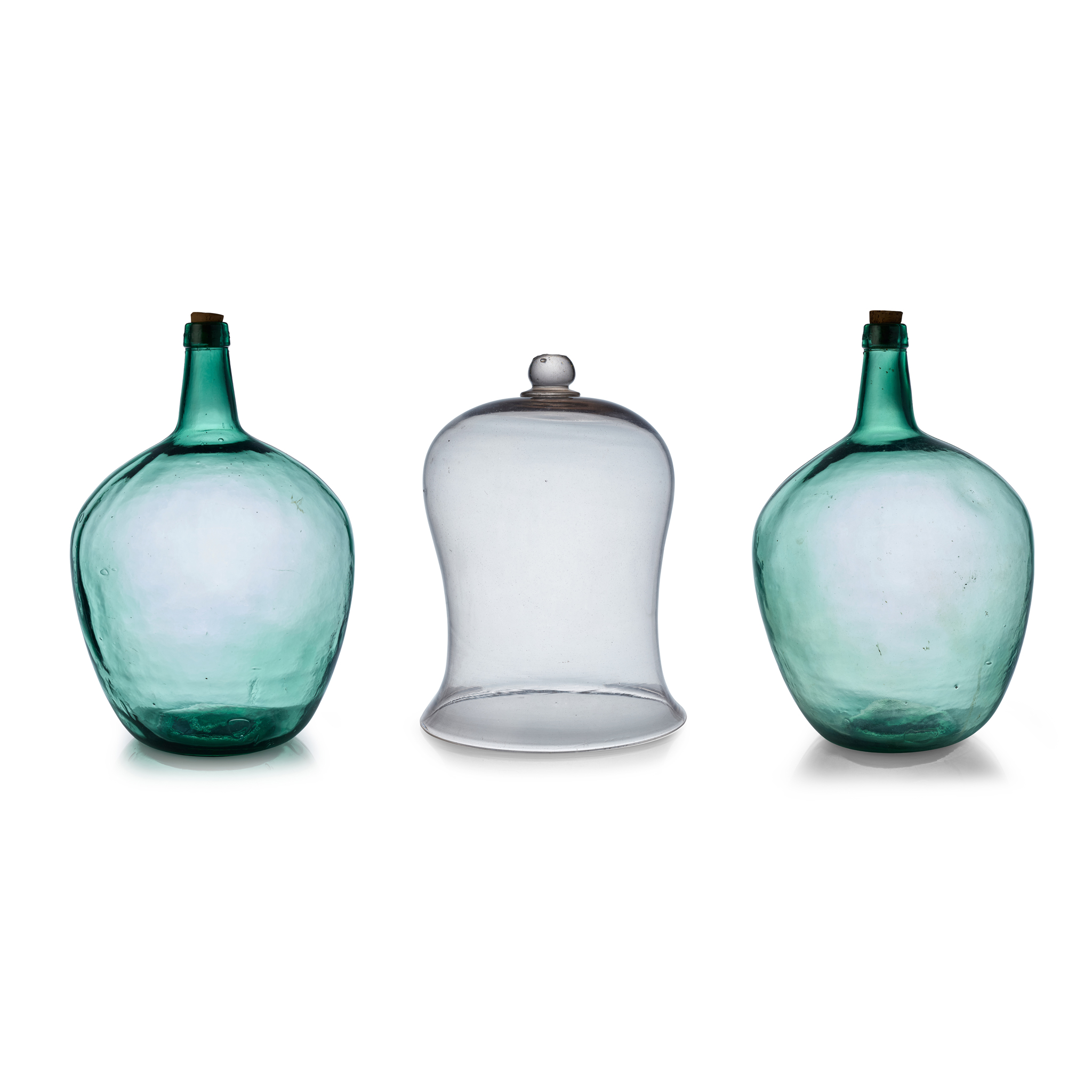 TWO GREEN GLASS CARBOYS