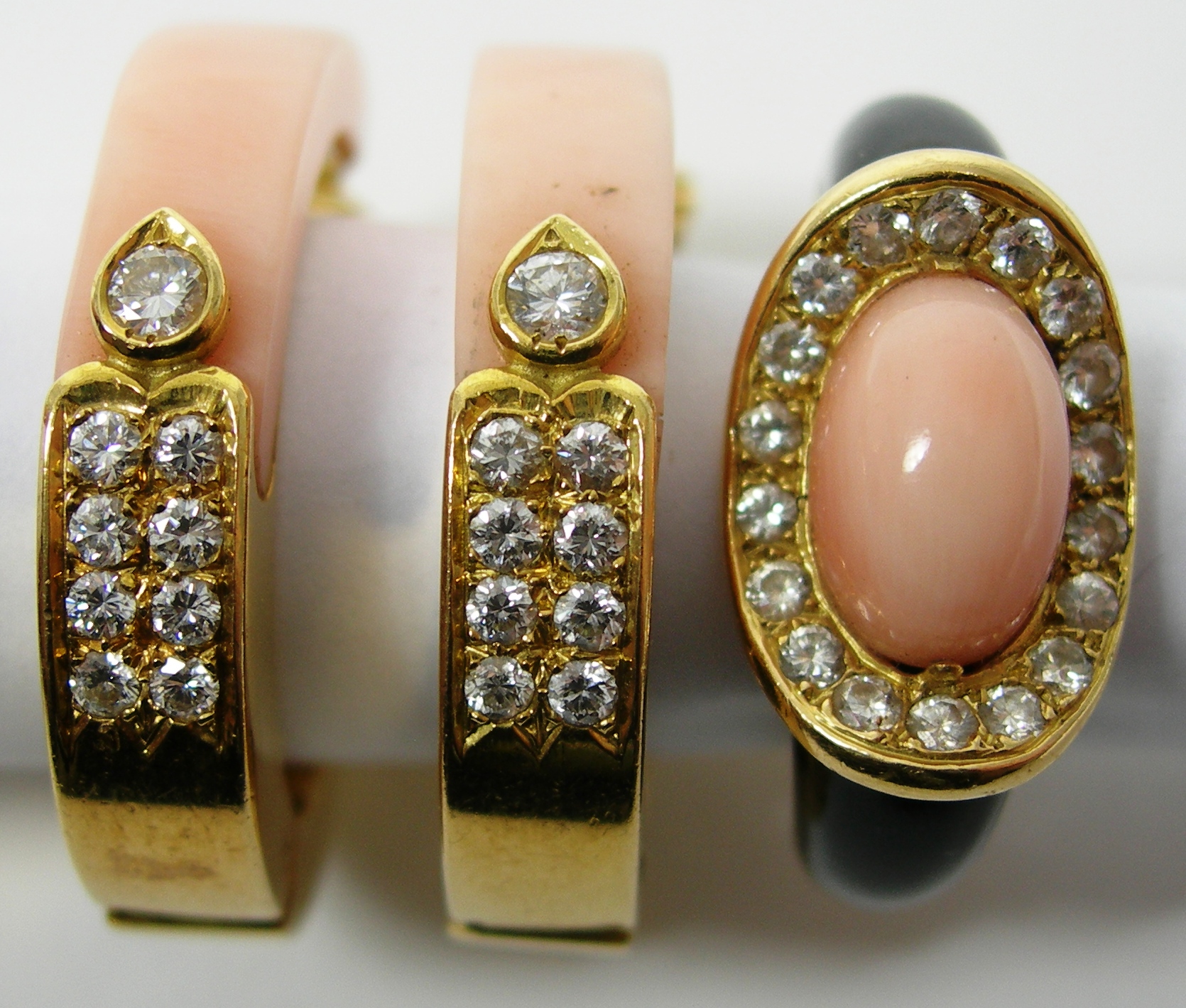 A pair of 18ct gold mounted coral and diamond set earrings,