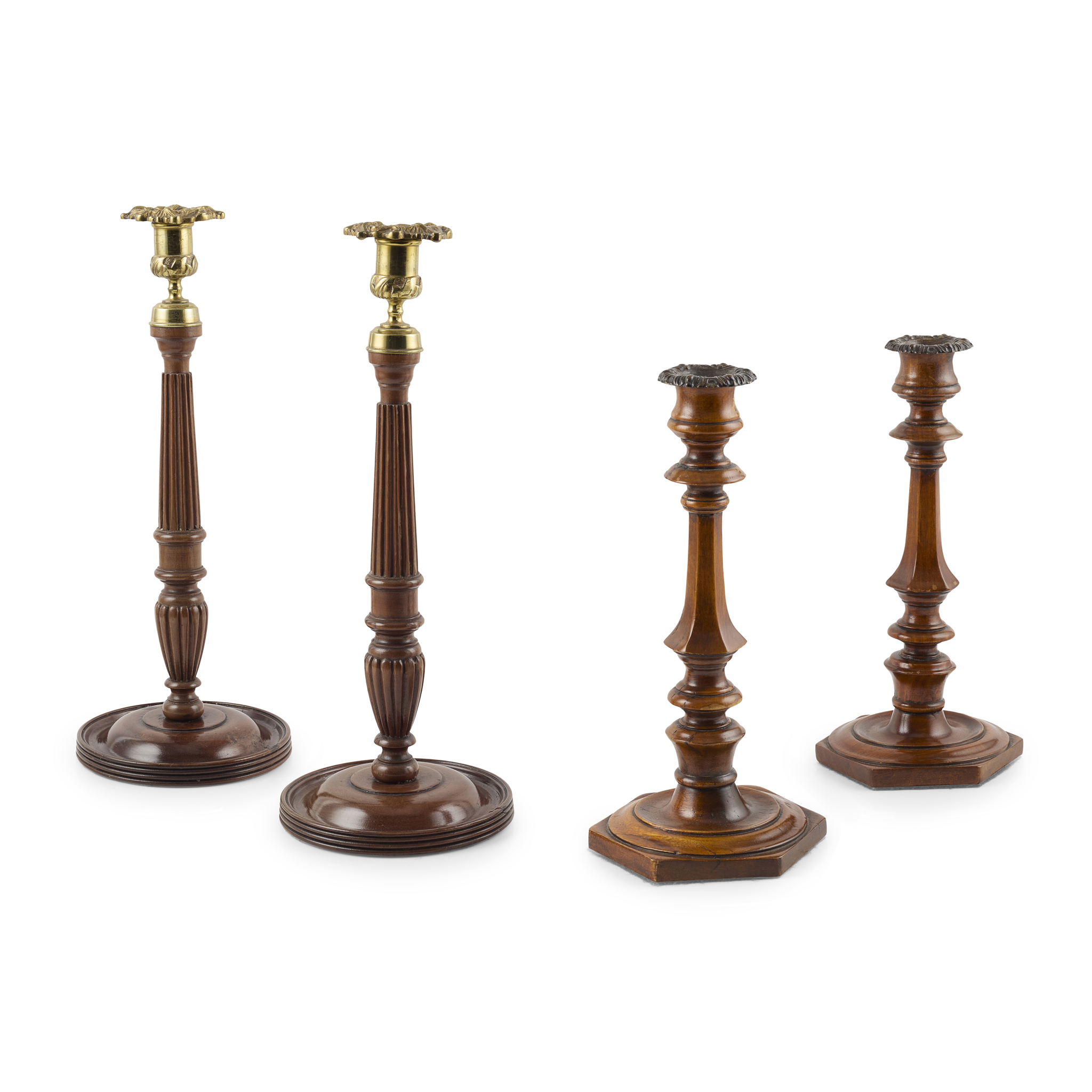 TWO PAIRS OF GEORGE III MAHOGANY AND BRASS CANDLESTICKS