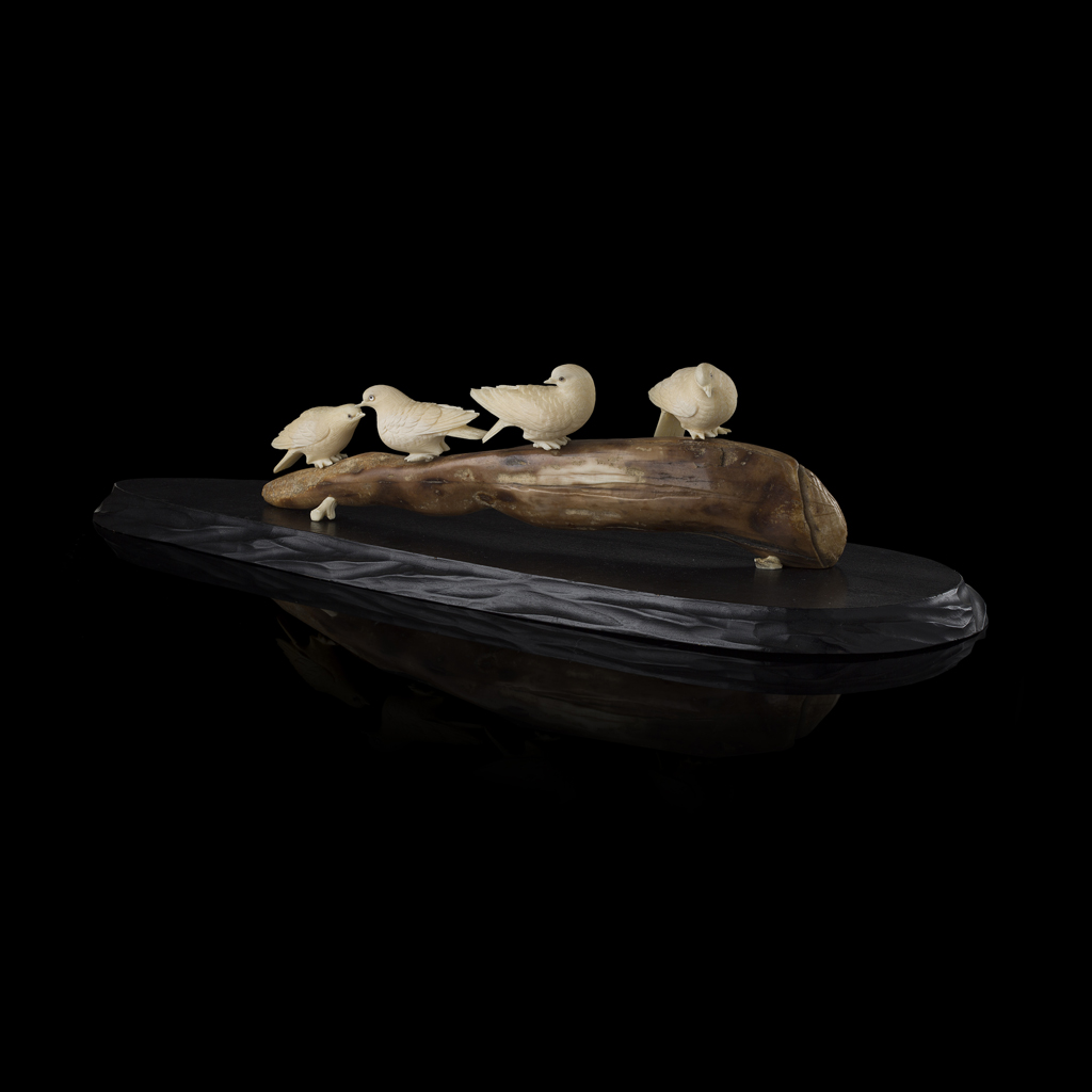 IVORY OKIMONO OF FOUR DOVES ON A PERCH