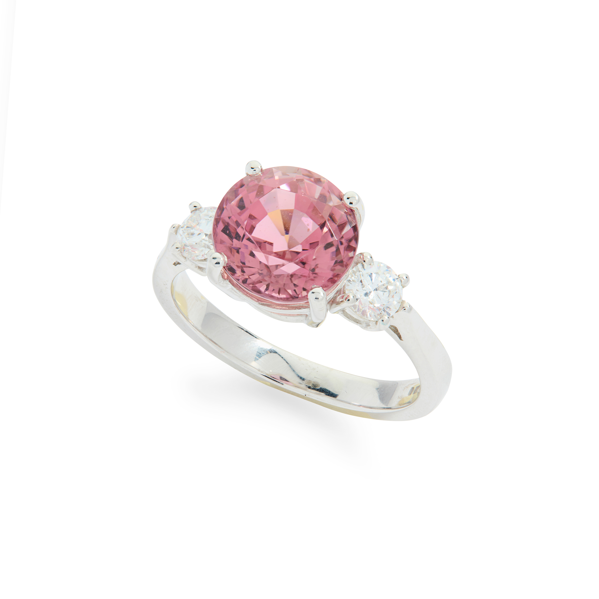An 18ct gold pink tourmaline and diamond three-stone ring