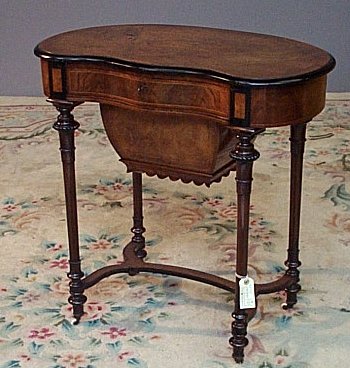 A Victorian walnut work table