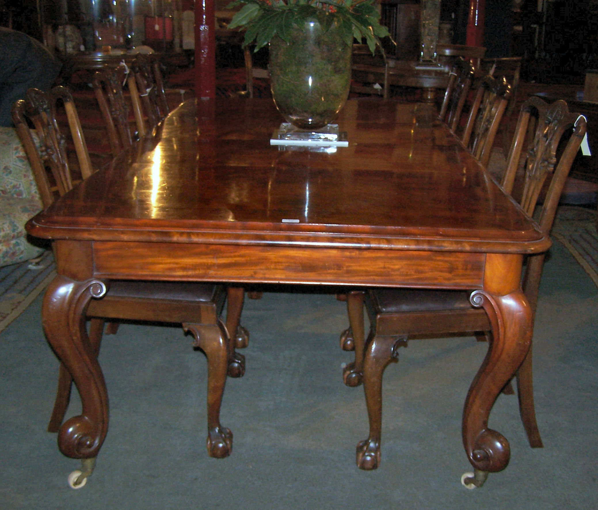 An early 20th century mahogany extending dining table,