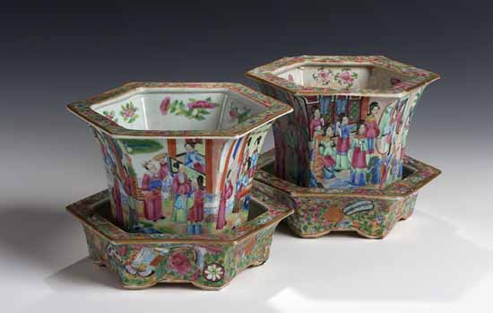 A pair of late 19th century Cantonese flared hexagonal section cache-pots and stands