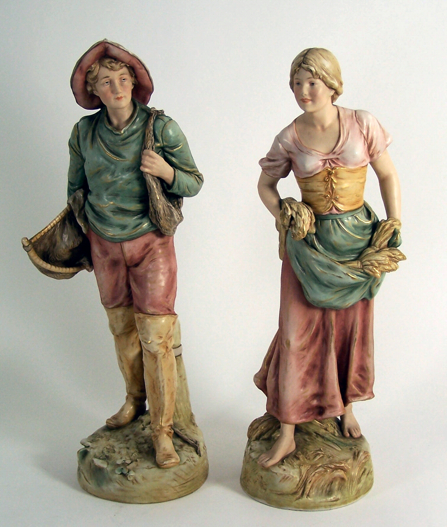 A pair of large Royal Dux figures,