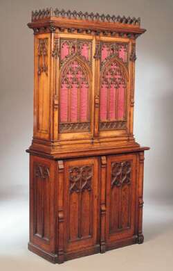 A Regency gothic oak bookcase cabinet