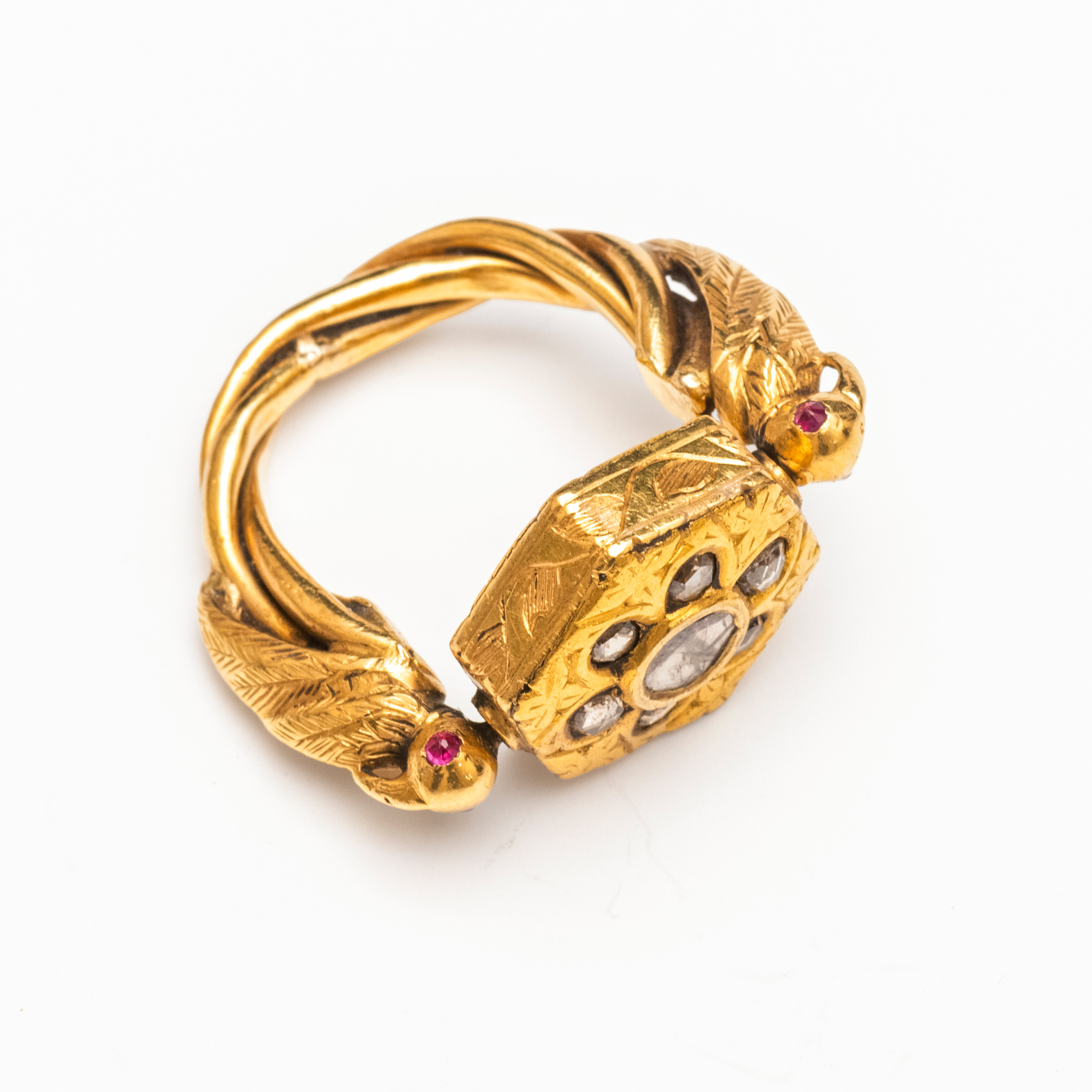 A DIAMOND AND RUBY-SET GOLD SWIVEL RING
