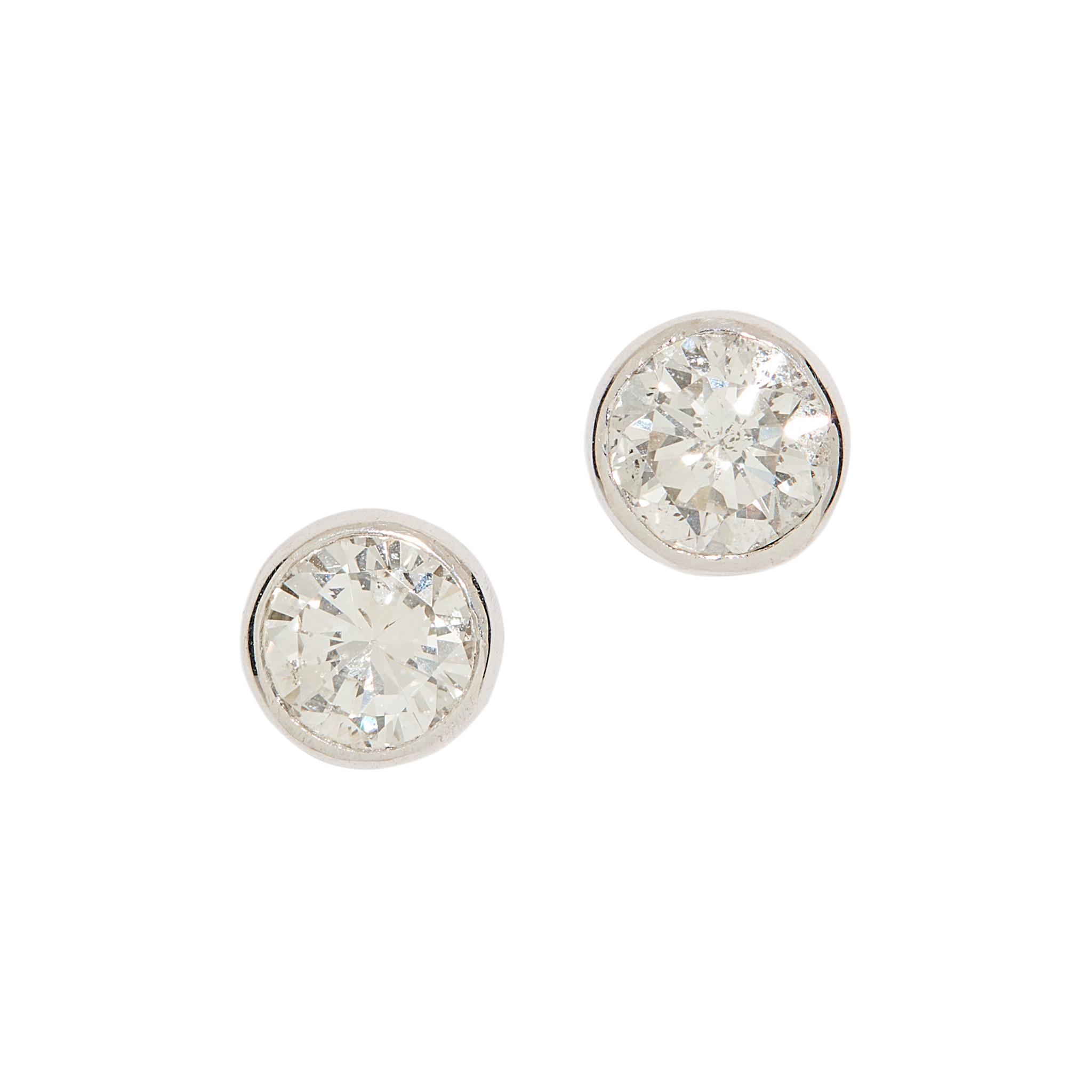 A pair of diamond stud earrings
