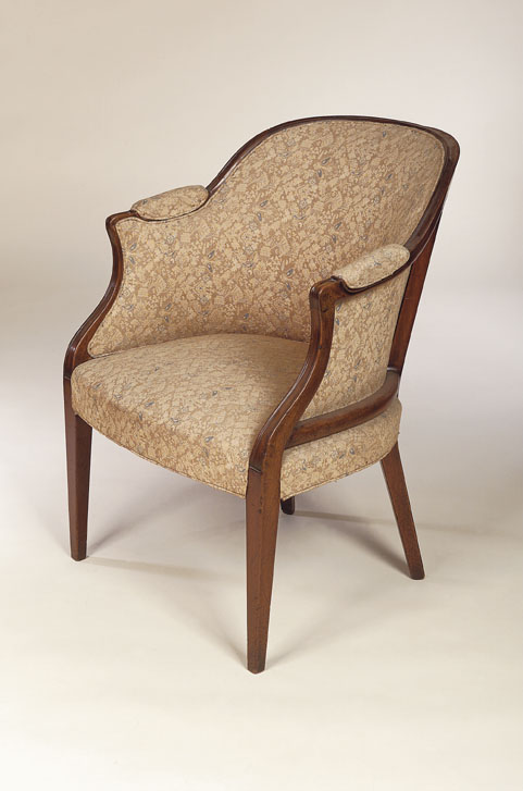 A George III mahogany framed upholstered bergere armchair
