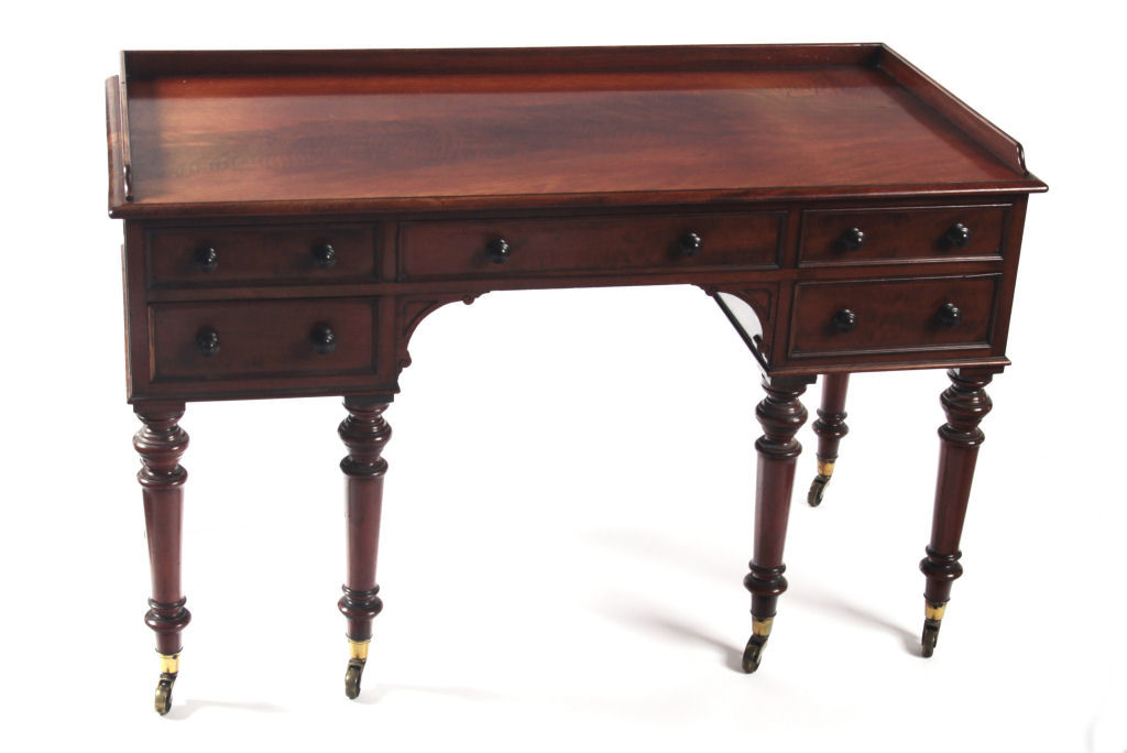 An adapted Victorian mahogany kneehole desk